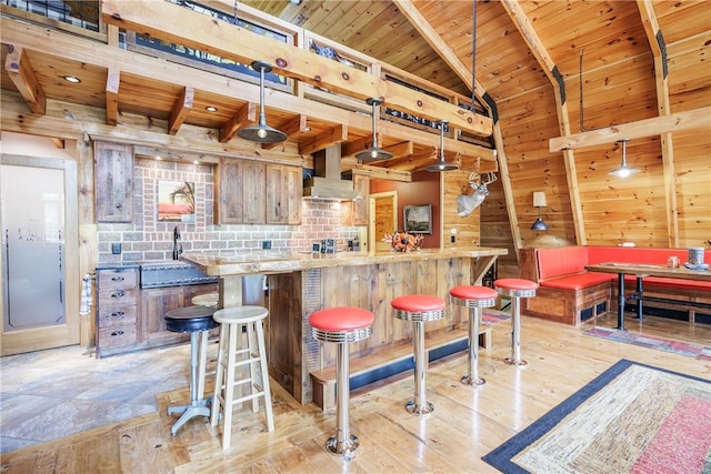 6684 Bishop Rd, Conesus, NY 14435 - indoor bar featuring a wooden ceiling with exposed beams, wall chimney exhaust hood, wooden walls, light wood-style floors, and hanging light fixtures