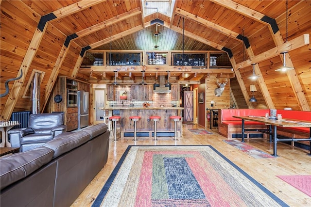 6684 Bishop Rd, Conesus, NY 14435 - living room featuring wood walls, a bar, lofted ceiling, and wood ceiling