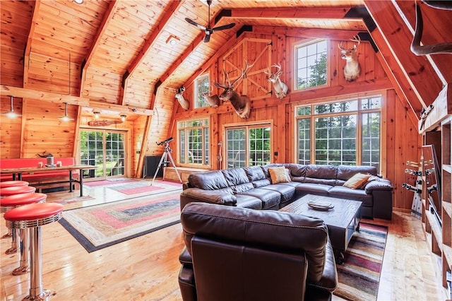 6684 Bishop Rd, Conesus, NY 14435 - living area featuring wooden walls, a wooden ceiling with exposed beams, hardwood / wood-style floors, high vaulted ceiling, and a ceiling fan