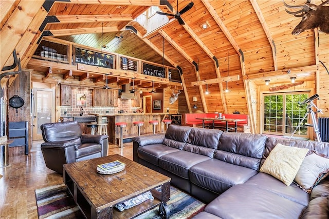 6684 Bishop Rd, Conesus, NY 14435 - living area with a wood ceiling with exposed beams, high vaulted ceiling, and wood walls