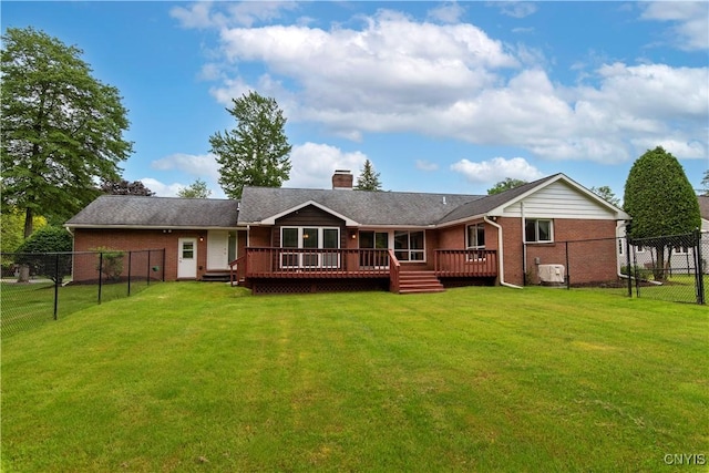 16 Silver Birch Ct, New Hartford, NY 13413 - back of property featuring a fenced backyard, brick siding, a chimney, and a wooden deck