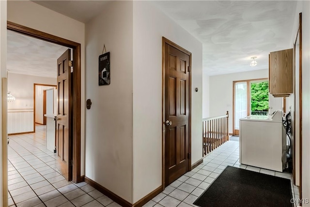 16 Silver Birch Ct, New Hartford, NY 13413 - corridor featuring washer / dryer and light tile patterned floors