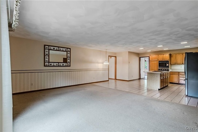 16 Silver Birch Ct, New Hartford, NY 13413 - unfurnished living room featuring light colored carpet, light tile patterned floors, and recessed lighting