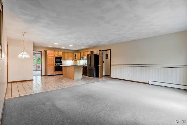 16 Silver Birch Ct, New Hartford, NY 13413 - kitchen featuring freestanding refrigerator, light tile patterned floors, light carpet, a kitchen island, and open floor plan