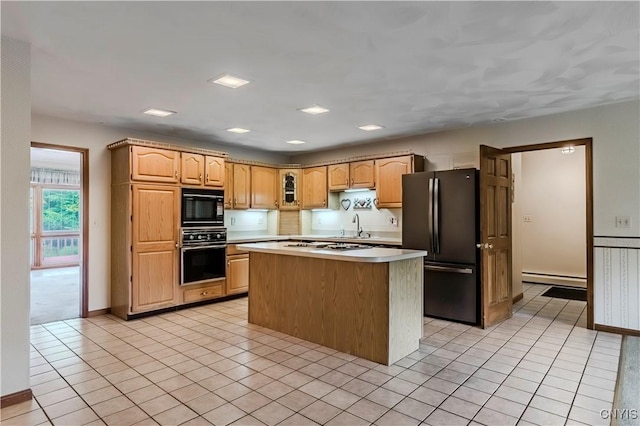 16 Silver Birch Ct, New Hartford, NY 13413 - kitchen featuring black appliances, baseboard heating, light countertops, a center island, and light tile patterned floors