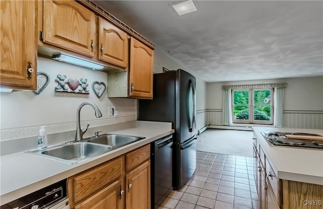 16 Silver Birch Ct, New Hartford, NY 13413 - kitchen featuring black dishwasher, stainless steel stovetop, a baseboard radiator, light countertops, and a wainscoted wall