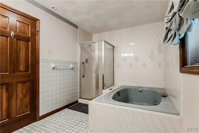 16 Silver Birch Ct, New Hartford, NY 13413 - bathroom with a stall shower, a tub with jets, tile patterned flooring, tile walls, and wallpapered walls
