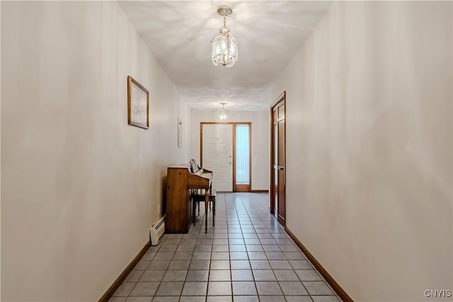 16 Silver Birch Ct, New Hartford, NY 13413 - hall featuring a baseboard heating unit, a chandelier, and light tile patterned flooring