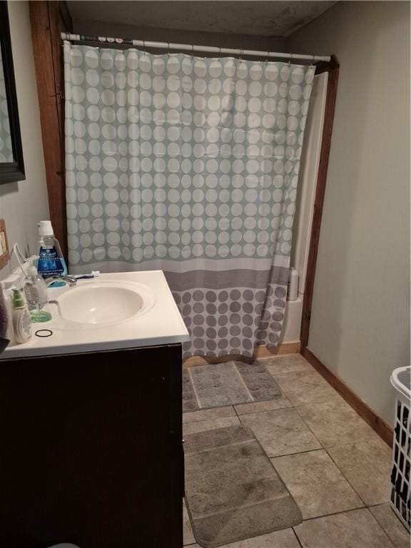 414 Oquaga Lake Rd, Sanford, NY 13754 - full bathroom with vanity, tile patterned flooring, and curtained shower