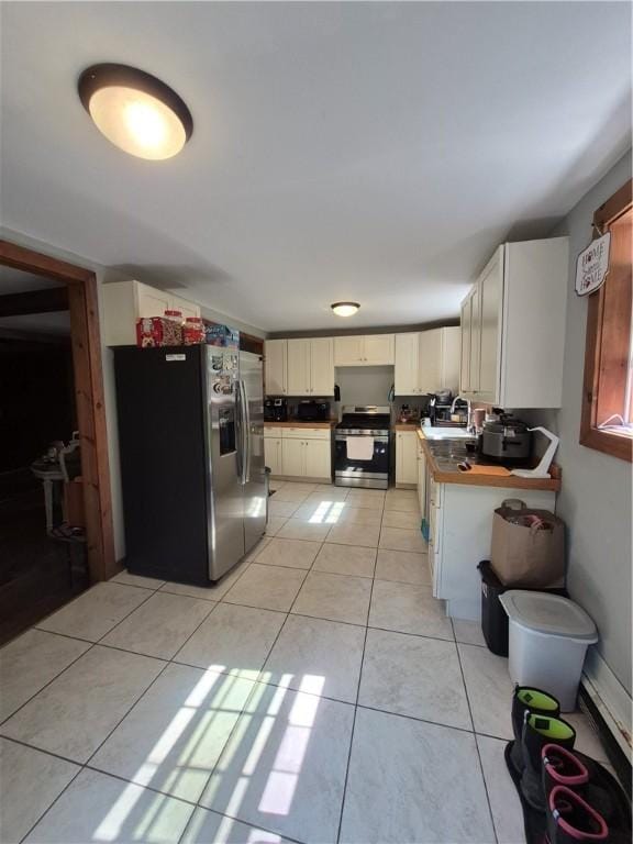 414 Oquaga Lake Rd, Sanford, NY 13754 - kitchen featuring appliances with stainless steel finishes and light tile patterned floors