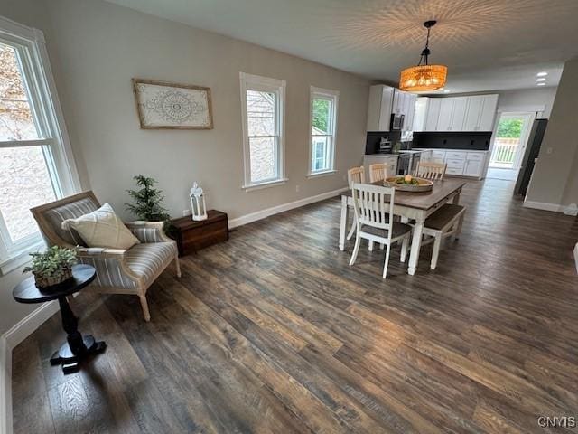 338 Leonard St, Oneida-Inside, NY 13421 - dining space featuring dark wood-style flooring and baseboards