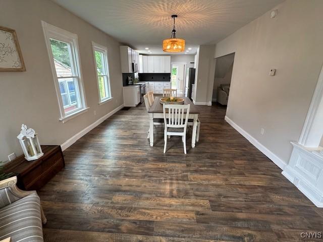 338 Leonard St, Oneida-Inside, NY 13421 - dining space with dark wood-style flooring