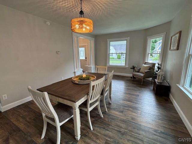 338 Leonard St, Oneida-Inside, NY 13421 - dining area featuring dark wood-type flooring and a chandelier