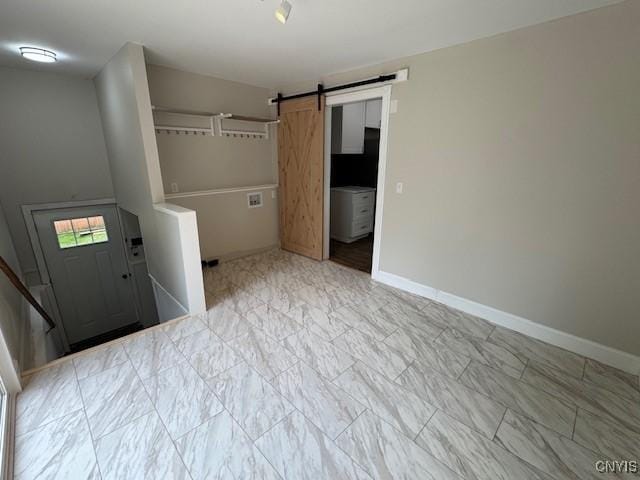 338 Leonard St, Oneida-Inside, NY 13421 - laundry area featuring a barn door and marble finish floors