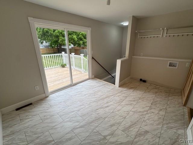 338 Leonard St, Oneida-Inside, NY 13421 - laundry area with light marble finish flooring, washer hookup, and ceiling fan