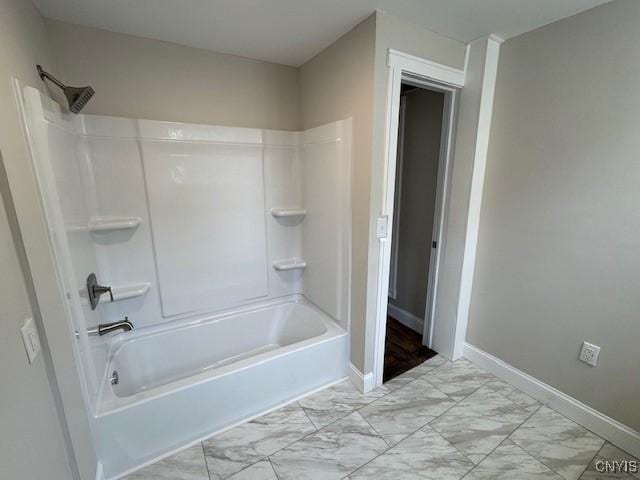 338 Leonard St, Oneida-Inside, NY 13421 - bathroom featuring marble look tiles and shower / bath combination