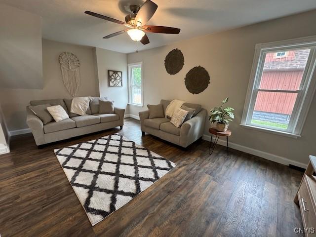 338 Leonard St, Oneida-Inside, NY 13421 - living area featuring a ceiling fan and dark wood-style floors