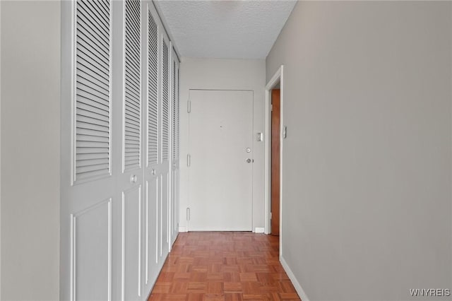 1088 Delaware Ave Unit 9I, Buffalo, NY 14209 - hallway featuring baseboards and a textured ceiling