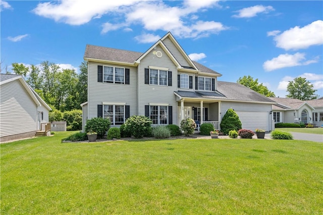 16 Leah Ln, Chili, NY 14514 - colonial home with a front yard, an attached garage, and concrete driveway