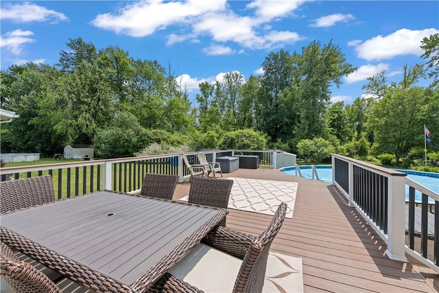 16 Leah Ln, Chili, NY 14514 - wooden terrace featuring an outdoor pool and view of scattered trees