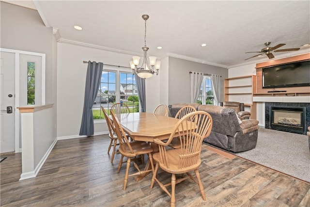 16 Leah Ln, Chili, NY 14514 - dining area with ornamental molding, a chandelier, a high end fireplace, wood finished floors, and a ceiling fan