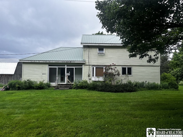 4871 Bayview Rd, Ellery, NY 14712 - rear view of house with a lawn and a metal roof