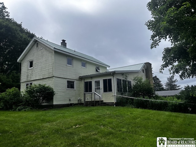 4871 Bayview Rd, Ellery, NY 14712 - rear view of property featuring a chimney and a yard