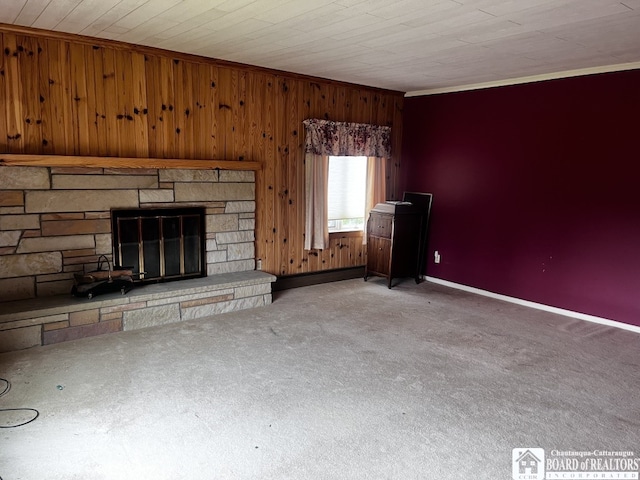 4871 Bayview Rd, Ellery, NY 14712 - unfurnished living room featuring carpet floors, wood walls, a stone fireplace, and ornamental molding