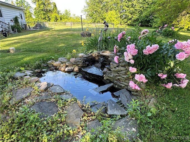 4214 Wilson Burt Rd, Wilson, NY 14172 - view of yard featuring a small pond
