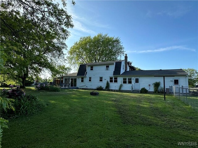 4214 Wilson Burt Rd, Wilson, NY 14172 - rear view of house with a chimney and entry steps