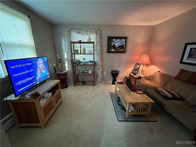 4214 Wilson Burt Rd, Wilson, NY 14172 - living area with light colored carpet and a baseboard heating unit