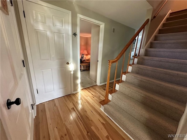 4214 Wilson Burt Rd, Wilson, NY 14172 - stairs featuring wood finished floors and baseboards