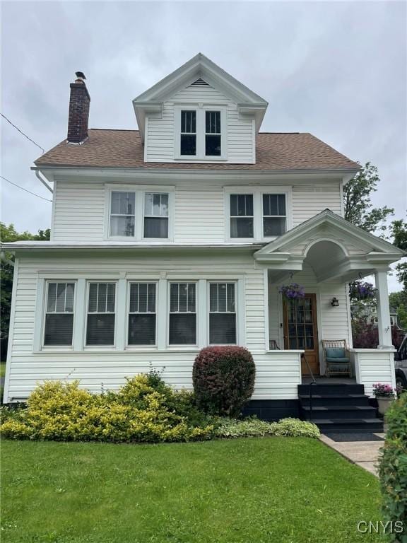 336 Hickok Ave, Syracuse, NY 13206 - traditional style home featuring a front lawn, a chimney, and roof with shingles