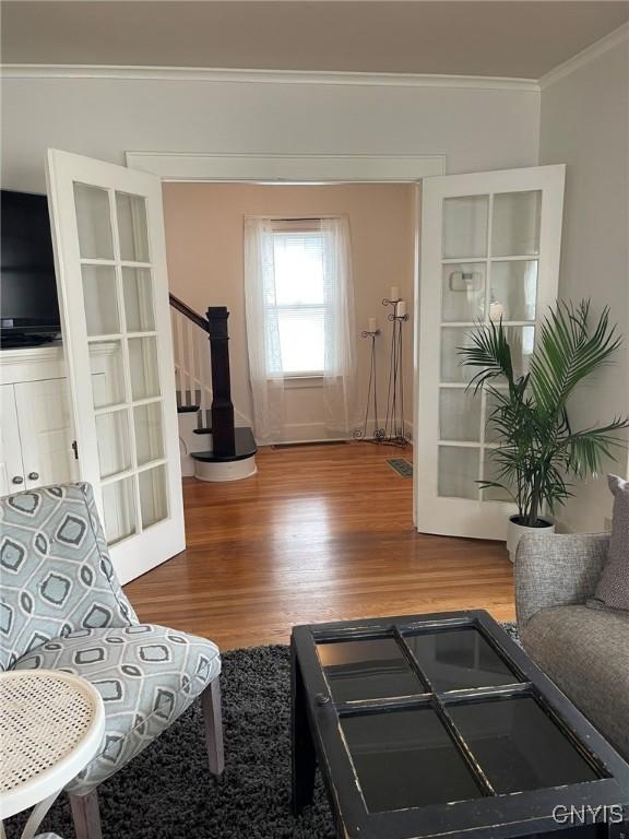 336 Hickok Ave, Syracuse, NY 13206 - living room with ornamental molding, wood finished floors, and stairway