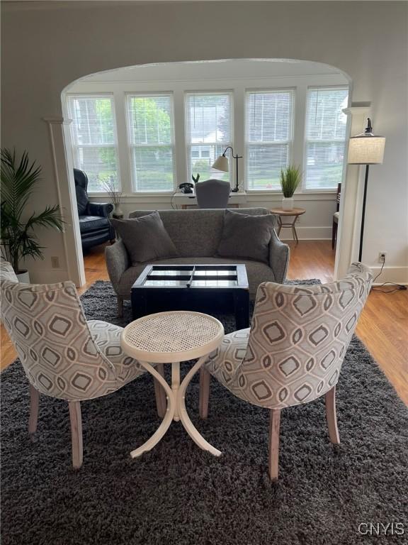 336 Hickok Ave, Syracuse, NY 13206 - living area with arched walkways, healthy amount of natural light, and wood finished floors