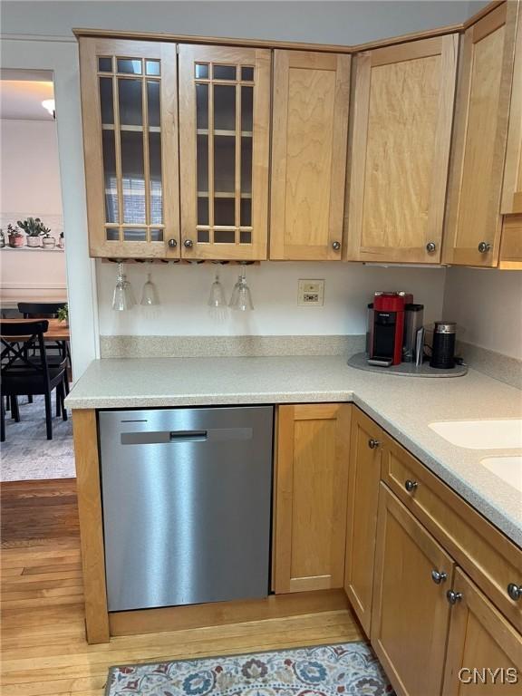 336 Hickok Ave, Syracuse, NY 13206 - kitchen with dishwasher, light wood finished floors, glass insert cabinets, and light countertops