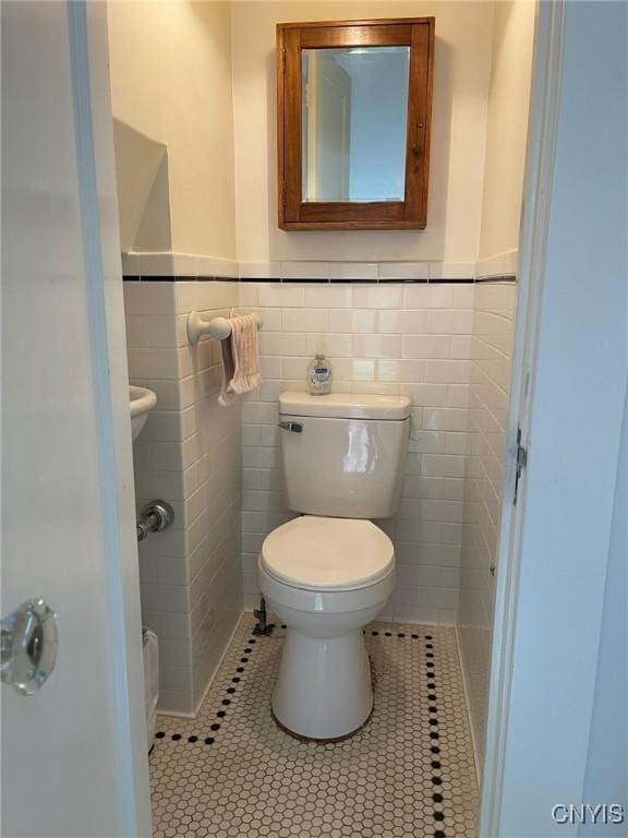 336 Hickok Ave, Syracuse, NY 13206 - bathroom featuring tile patterned floors, tile walls, and wainscoting