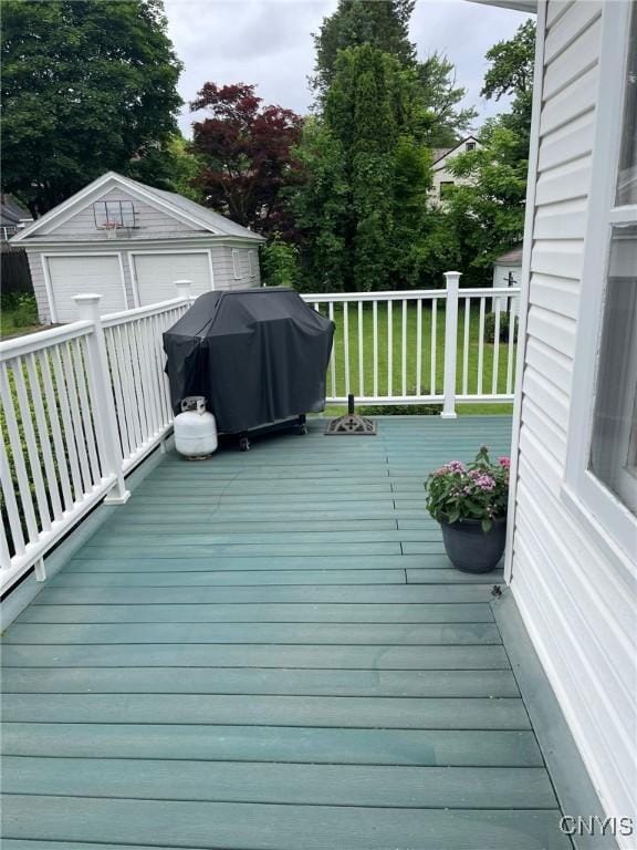 336 Hickok Ave, Syracuse, NY 13206 - wooden terrace featuring a grill, an outbuilding, and a detached garage
