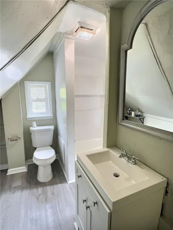 60 Clairmount St, Rochester, NY 14621 - bathroom featuring vanity, wood finished floors, and lofted ceiling