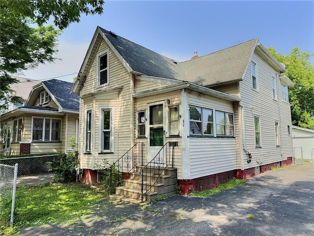 60 Clairmount St, Rochester, NY 14621 - view of front of house featuring entry steps and roof with shingles
