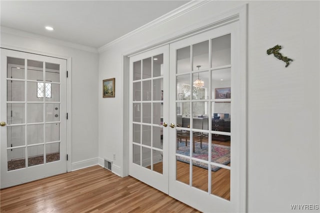 580 Roycroft Blvd, Cheektowaga, NY 14225 - entryway with french doors, wood finished floors, and crown molding