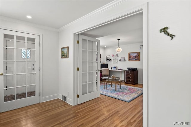 580 Roycroft Blvd, Cheektowaga, NY 14225 - entryway featuring wood finished floors, ornamental molding, recessed lighting, french doors, and a chandelier