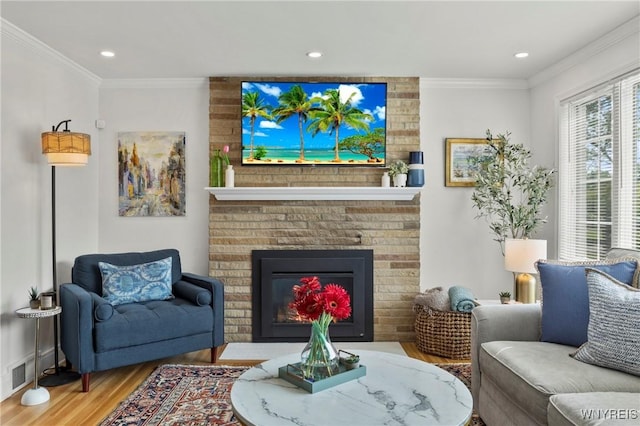 580 Roycroft Blvd, Cheektowaga, NY 14225 - living room with wood finished floors, ornamental molding, recessed lighting, and a brick fireplace