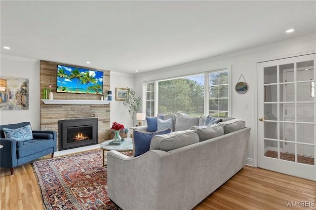 580 Roycroft Blvd, Cheektowaga, NY 14225 - living area with ornamental molding, wood finished floors, a brick fireplace, and recessed lighting