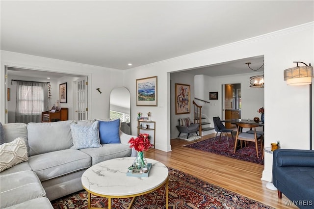 580 Roycroft Blvd, Cheektowaga, NY 14225 - living room with wood finished floors, crown molding, and a chandelier