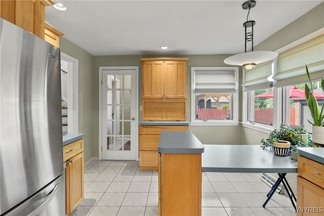 580 Roycroft Blvd, Cheektowaga, NY 14225 - kitchen with freestanding refrigerator, recessed lighting, pendant lighting, light tile patterned flooring, and a kitchen island