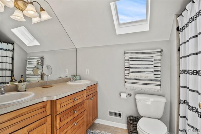 580 Roycroft Blvd, Cheektowaga, NY 14225 - full bath with a skylight, vaulted ceiling, double vanity, and tile patterned floors