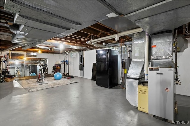 580 Roycroft Blvd, Cheektowaga, NY 14225 - unfinished basement featuring freestanding refrigerator, water heater, electric panel, and heating unit