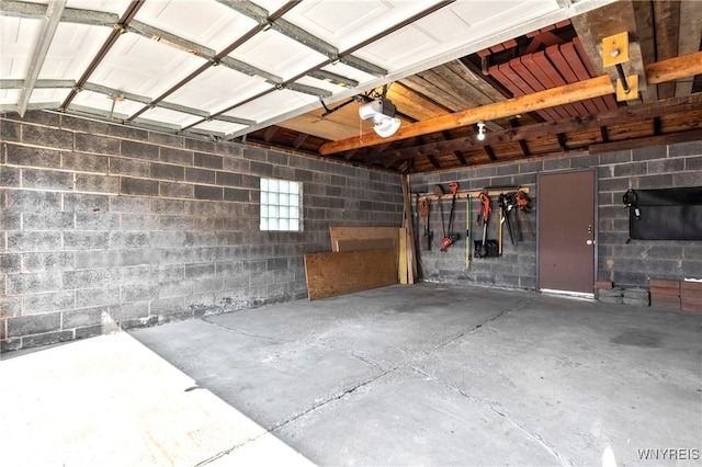 580 Roycroft Blvd, Cheektowaga, NY 14225 - garage featuring a garage door opener and concrete block wall