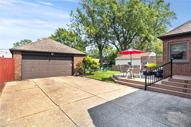 580 Roycroft Blvd, Cheektowaga, NY 14225 - view of patio with a detached garage, outdoor dining area, and an outdoor structure